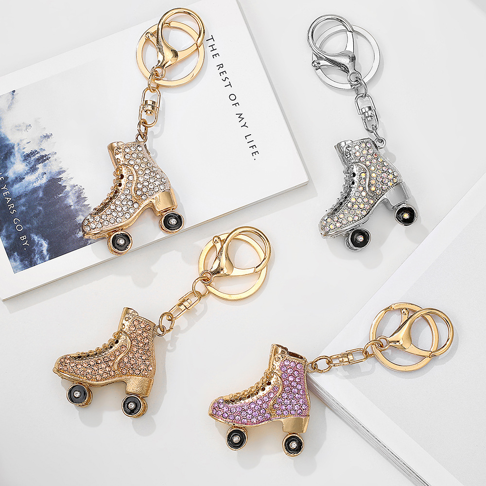 Amazon wholesale metal pendant luminous unique Roller skates fashion diamond small gift creative metal keychain for Sweater chain